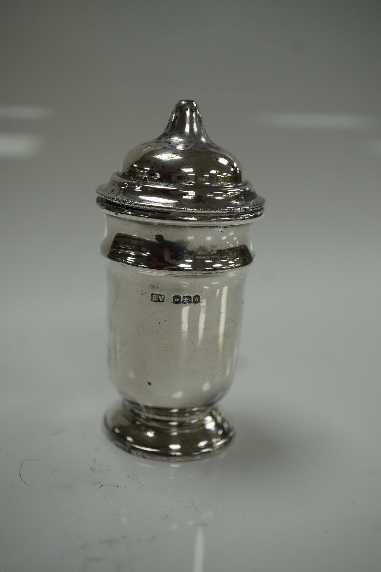 An Elizabeth II silver three piece condiment set, Sheffield, 1964, six assorted silver napkin rings and a stylish Austro Hungarian white metal pill box, by George Adam Scheid, 62mm. Condition - fair